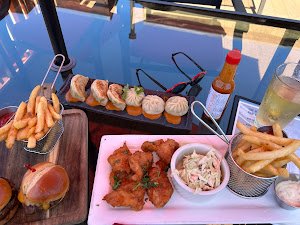 Burgers, fries, fried chicken, and momo platter at The Walnut Tavern Bar & Grill, 1508 Walnut St, Berkeley CA 94709