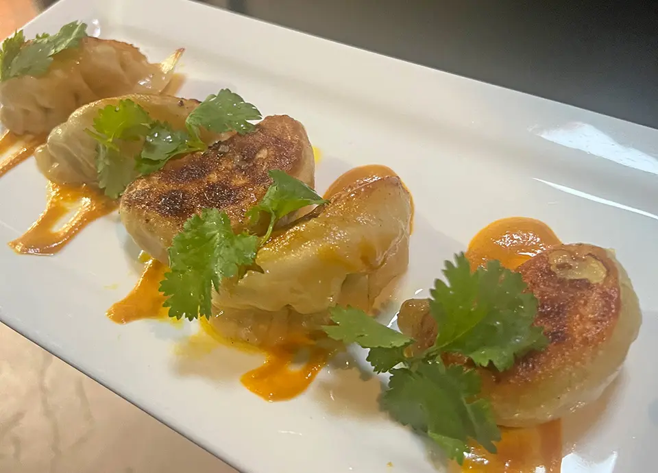 Momo platter with dumplings at The Walnut Tavern Bar & Grill, American restaurant and bar in Berkeley, CA 94709