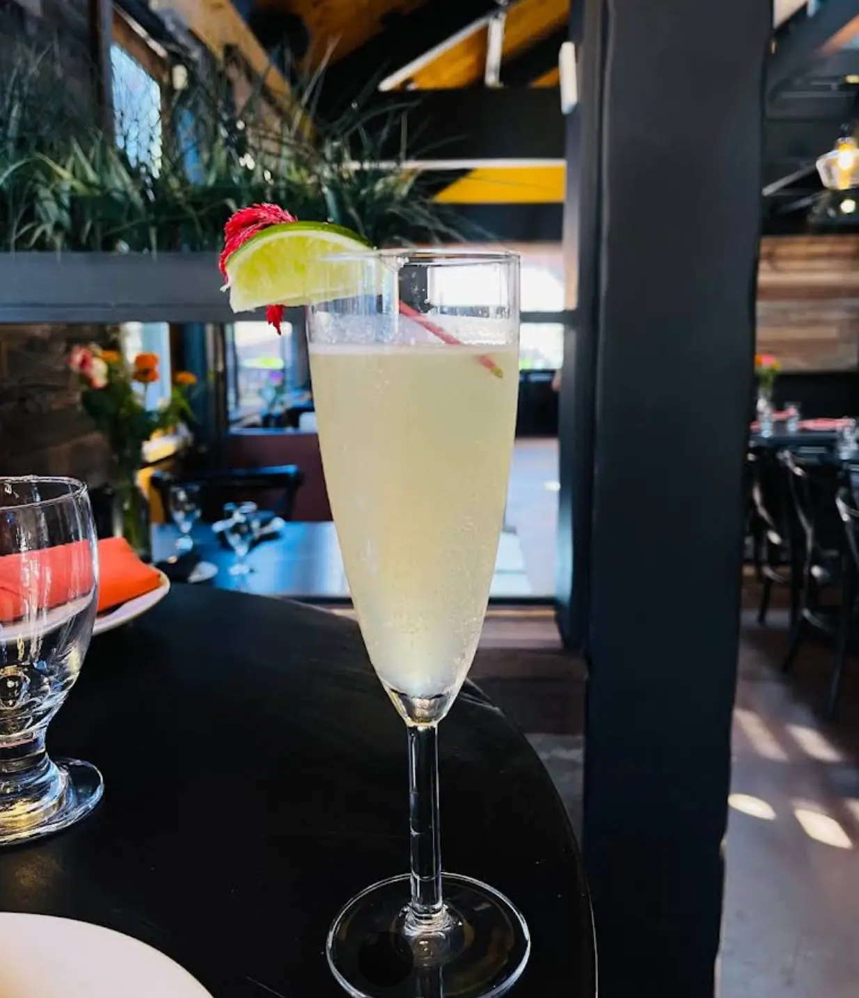 Refreshing mimosa with lime garnish at The Walnut Tavern Bar & Grill Skiplyn Berkeley CA 94709